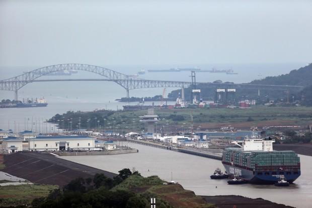 The COSCO Shipping Panama cargo ship prepares to enter the new Cocoli locks, part of the new Panama Canal expansion project, in Panama City, Sunday, June 26, 2016. Authorities are hosting a big bash to inaugurate newly expanded locks that will double the Canal's capacity, as the country makes a multibillion-dollar bet on a bright economic future despite tough times for international shipping. (AP Photo/Dario Lopez-Mills)