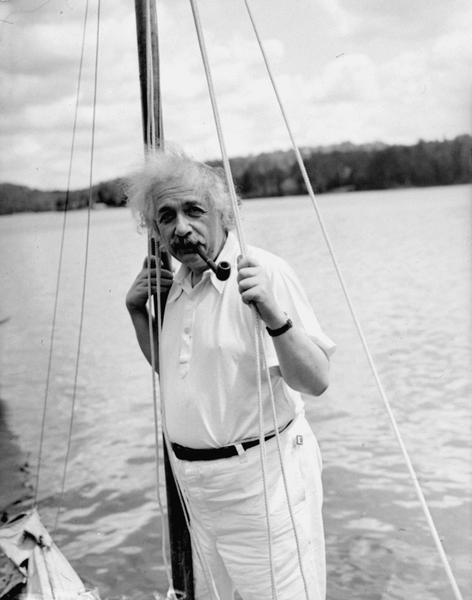 Professor Albert Einstein began an Adirondacks vacation, July 3, 1936, with a nine-hour sailing lark that really wound up as a towing operation with a reporter's speed boat on the pulling end.  The mathematician is shown leaning against the mast of his boat at Saranac Lake, New York. (AP Photo)